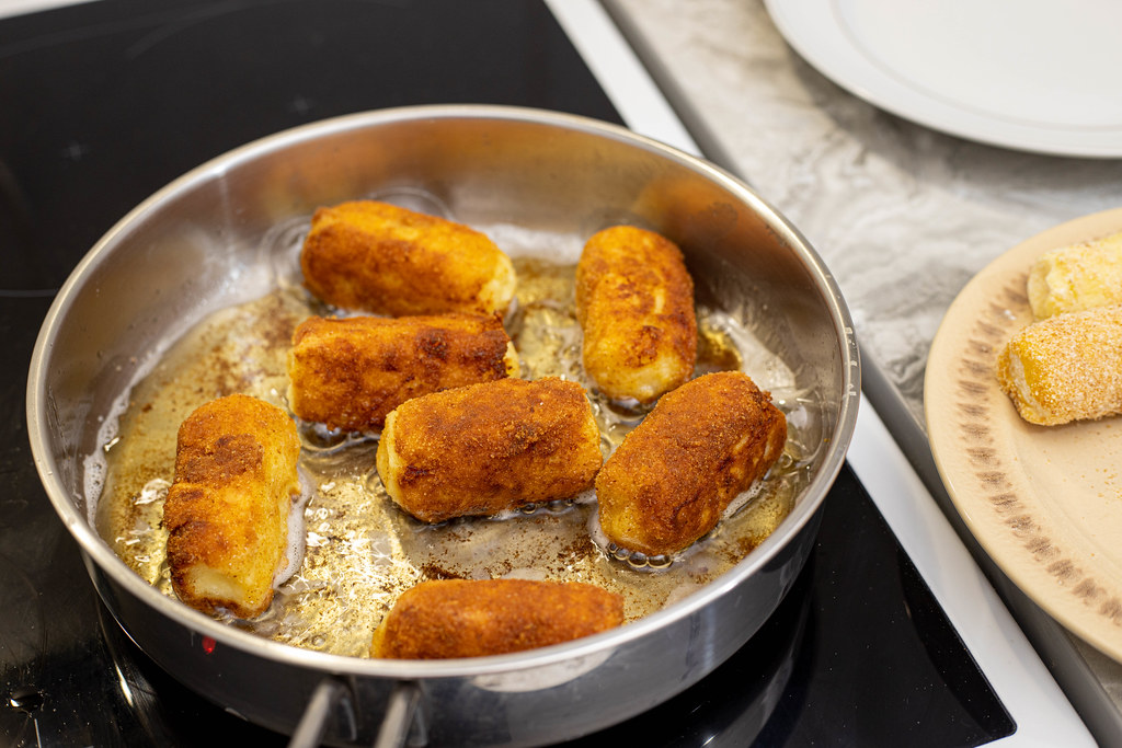 Potatoe Croquettes frying in the hot oil