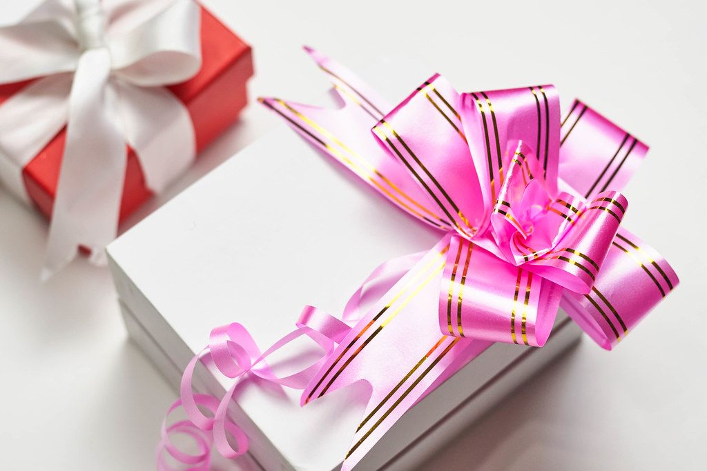 present box packed with pink festive ribbon