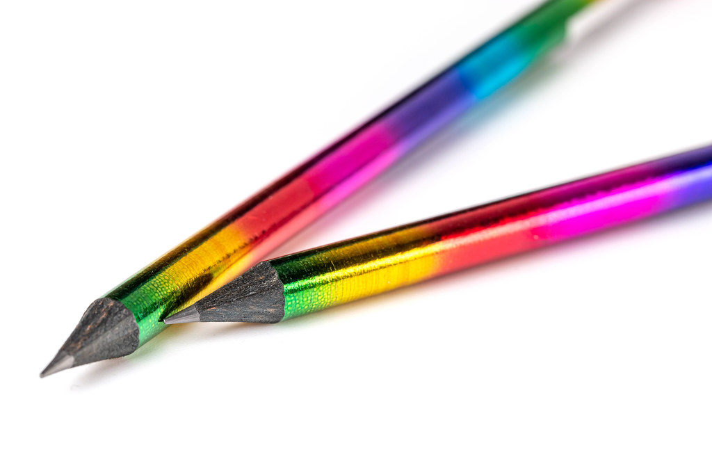 Rainbow pencils on white background