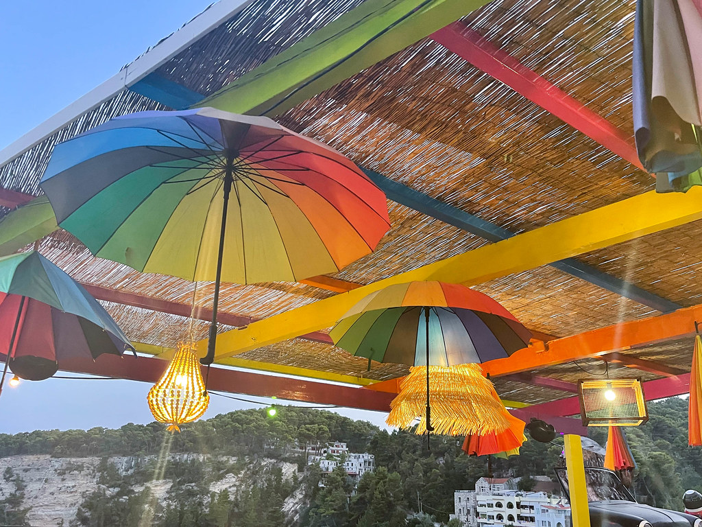 Rainbow umbrellas decorating Favela restaurant on Patitiri seafront on Alonnisos