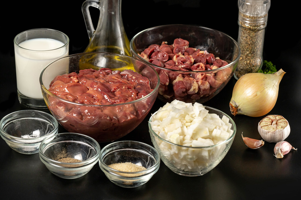 Raw ingredients for making pate on dark background