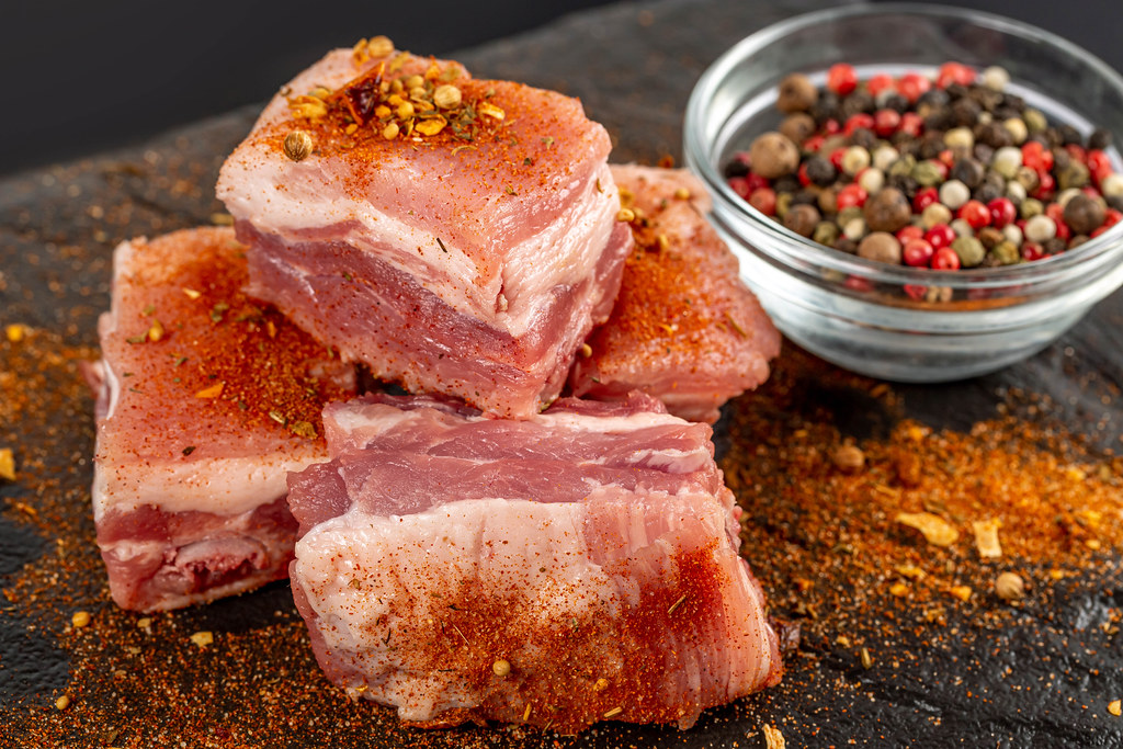 Raw pork ribs with spices, close-up