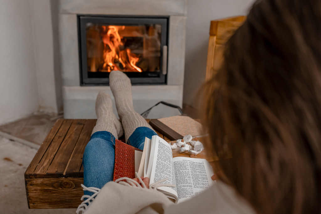 Reading Book While Warming Feet