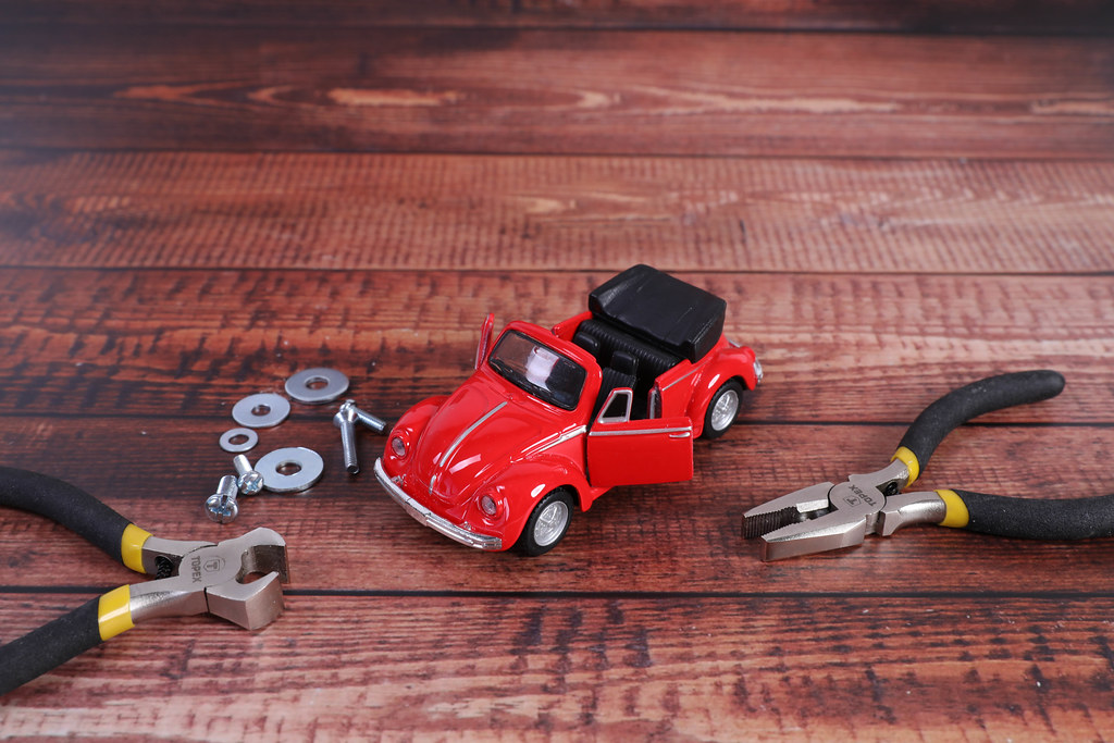 Red car and a set of tools for repair
