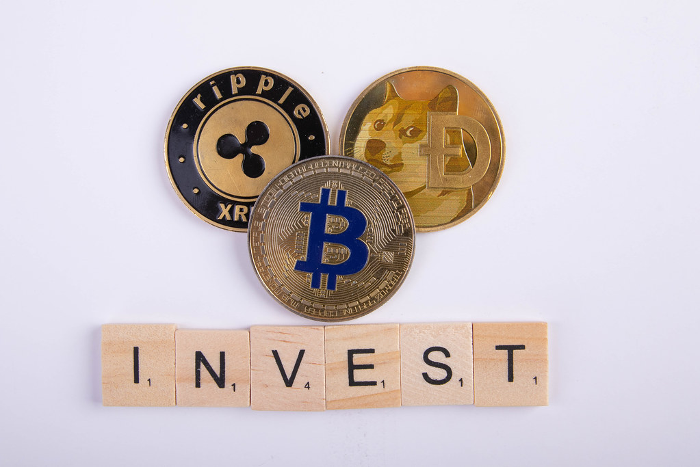 Ripple, Dogecoin and Bitcoin with Invest text