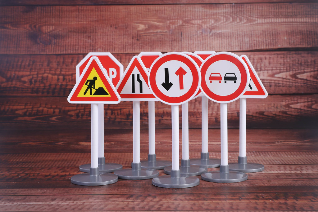 Road signs on wooden table