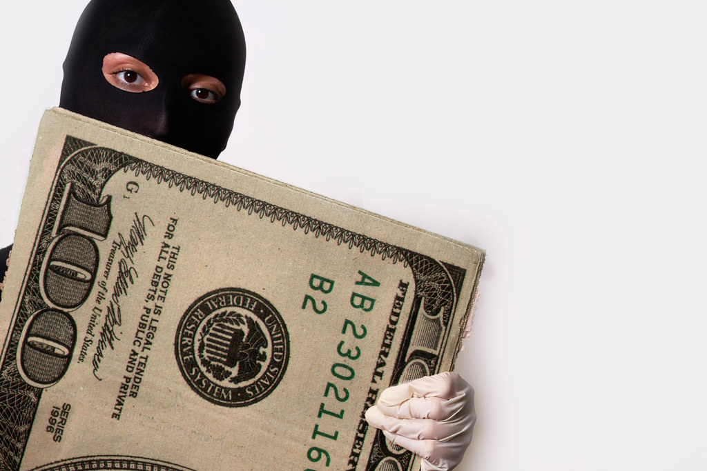 Robber showing stolen money