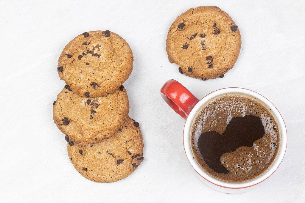Round Chocolate Cookies with Cup of Coffee on the table