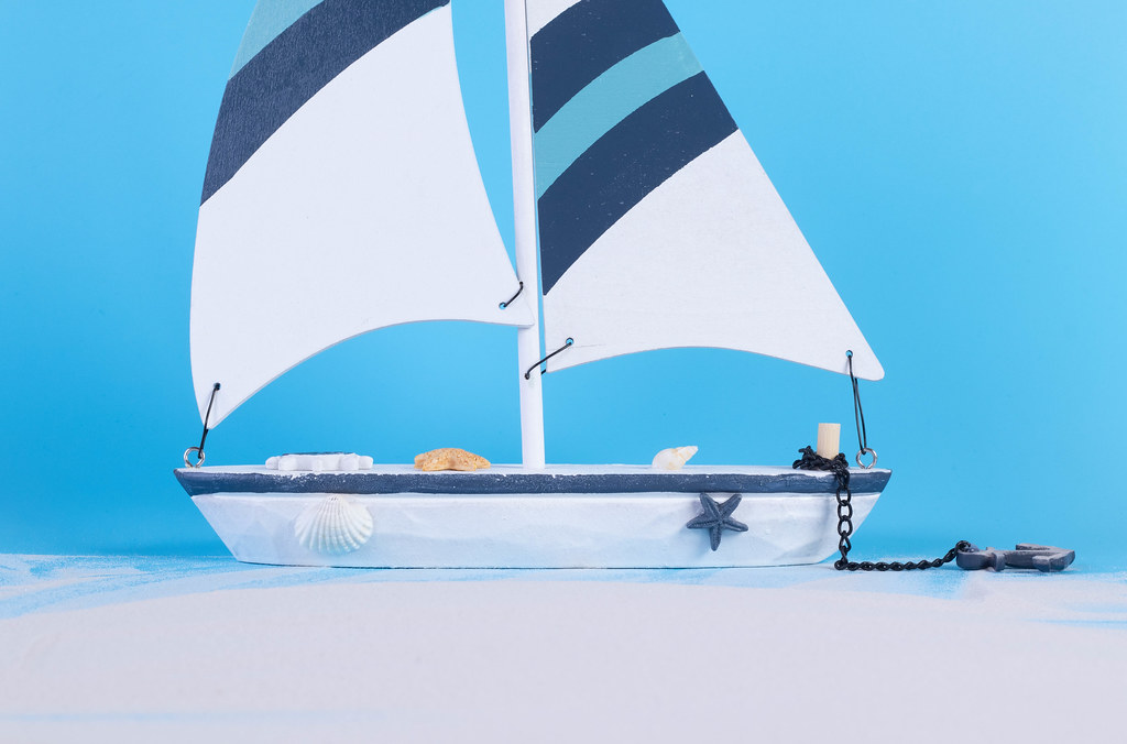 Sailing boat with blue background