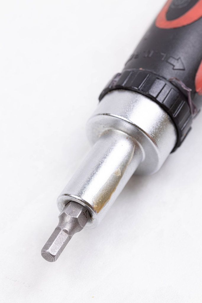 Screwdriver with Hex bit isolated above white background