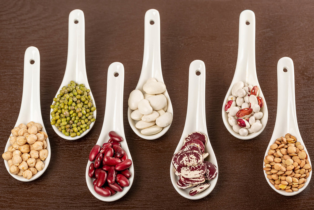 Set kinds of beans in ceramic spoon