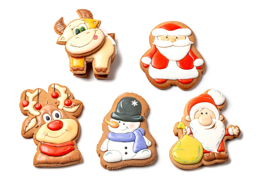 Set of christmas multicolored gingerbread cookies with icing on white