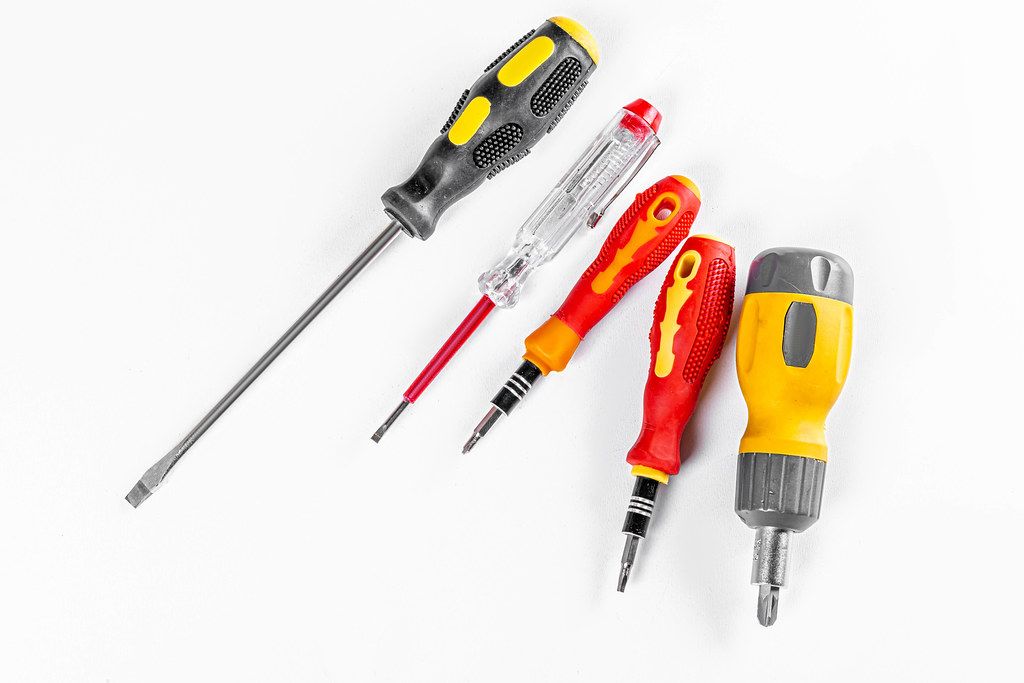 Set of different screwdrivers on a white background