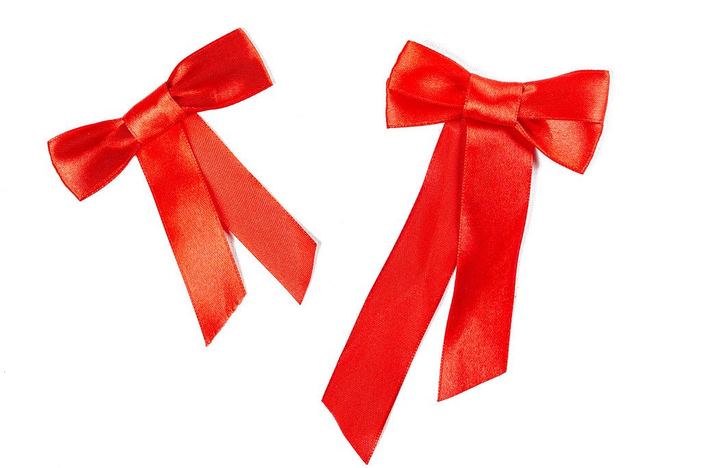 Set of two beautiful handmade gift bows made of bright red silk ribbon
