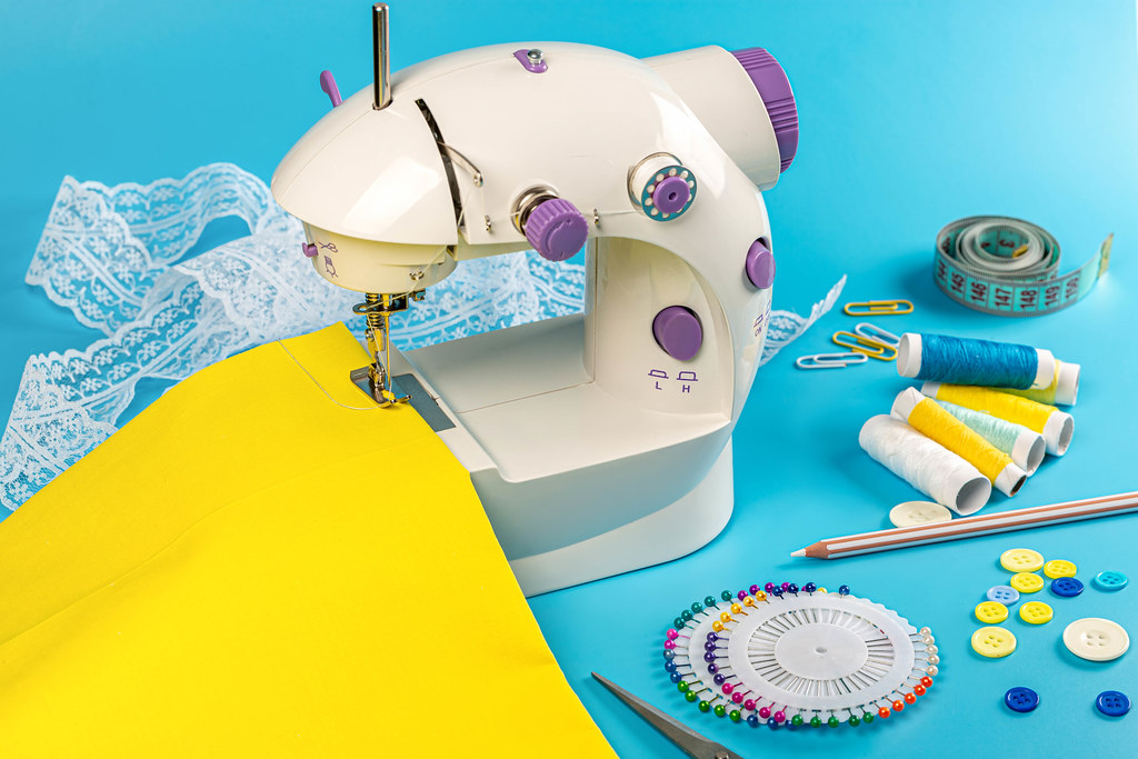 Sewing craft background with sewing machine and accessories