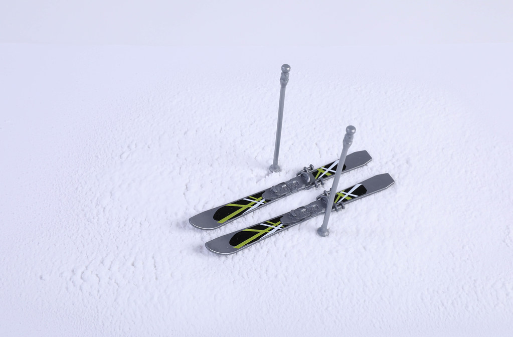 Skis with sticks on the snow