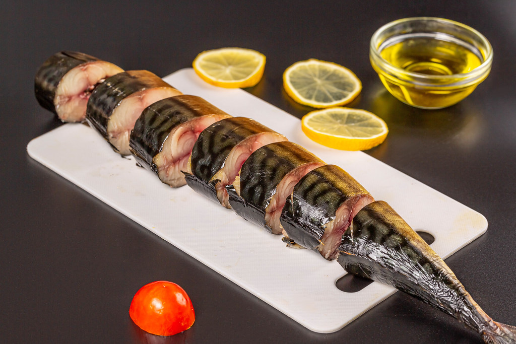 Sliced smoked mackerel on a cutting board