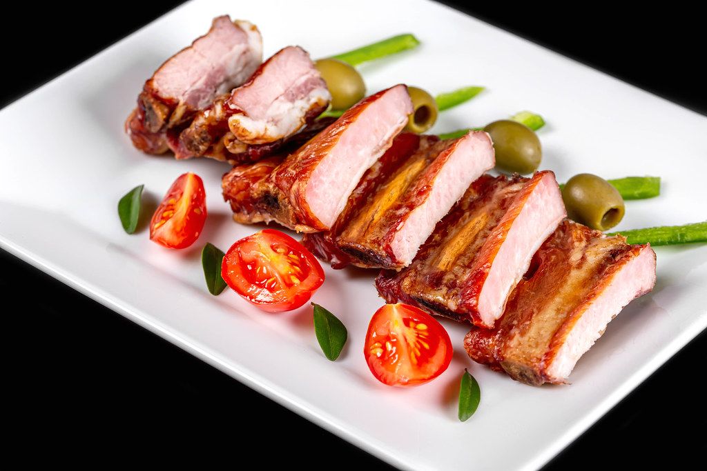Sliced smoked pork ribs, close-up