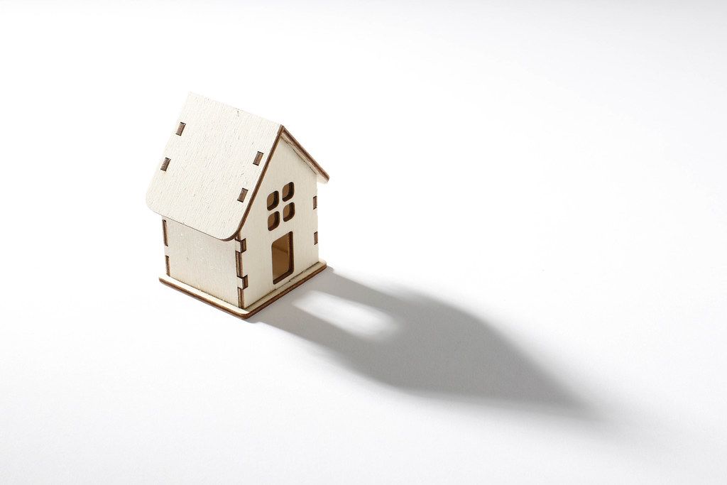 Small wooden house on white background