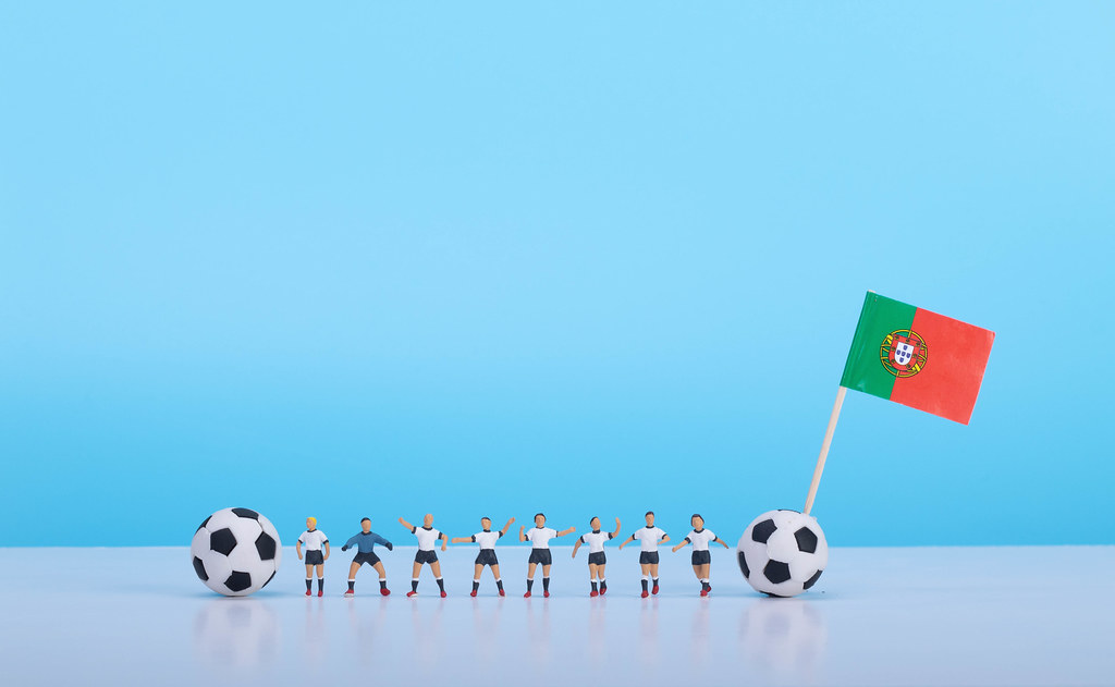 Soccer players with flag of Portugal