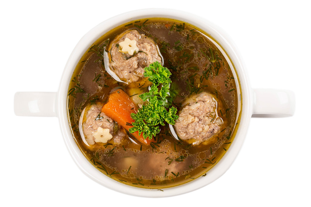 Soup with meatballs, potato and carrots, top view