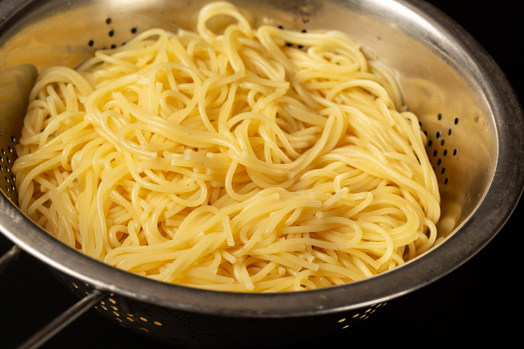 Spaghetti pasta in a colander