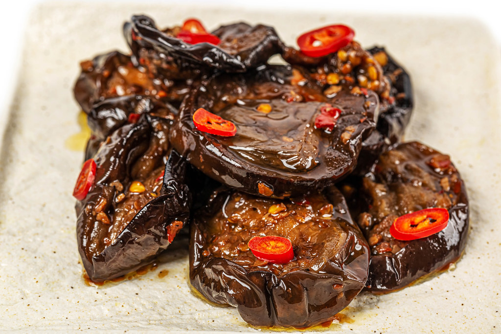 Spicy fried eggplant with red pepper, close-up