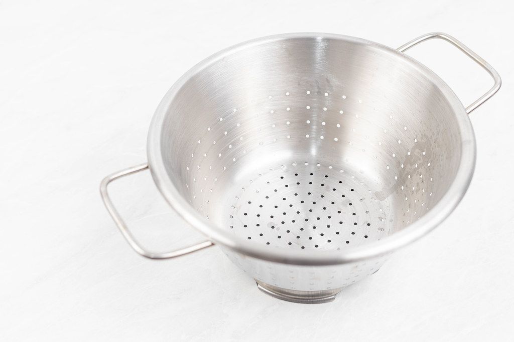 Stainless Steel Strainer On The White Background 