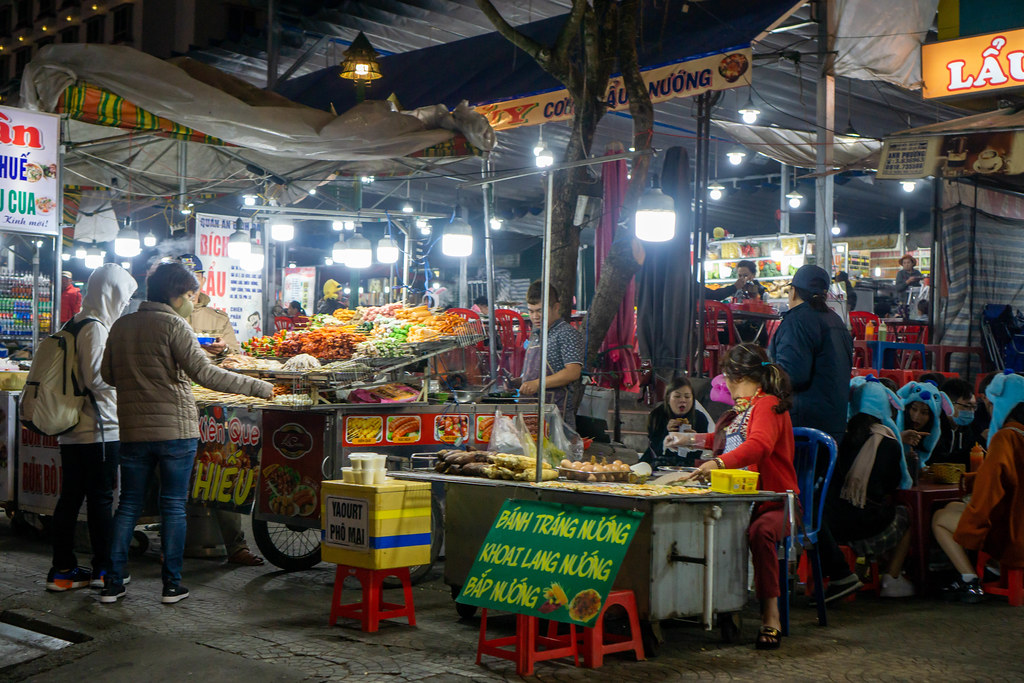 Street Food Carts selling Vietnamese Snacks and Barbecue at Dalat Night Market in the City Center of Da Lat, Vietnam