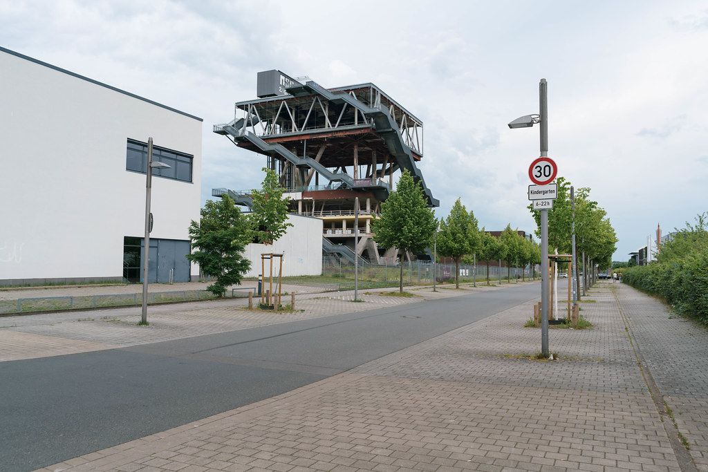 Street in Hannover with abandoned Expo 2000 pavilion of Netherlands in the background