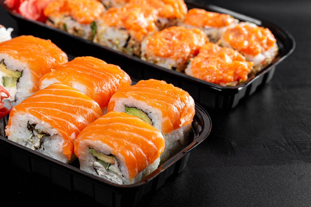 Sushi in plastic containers, close-up