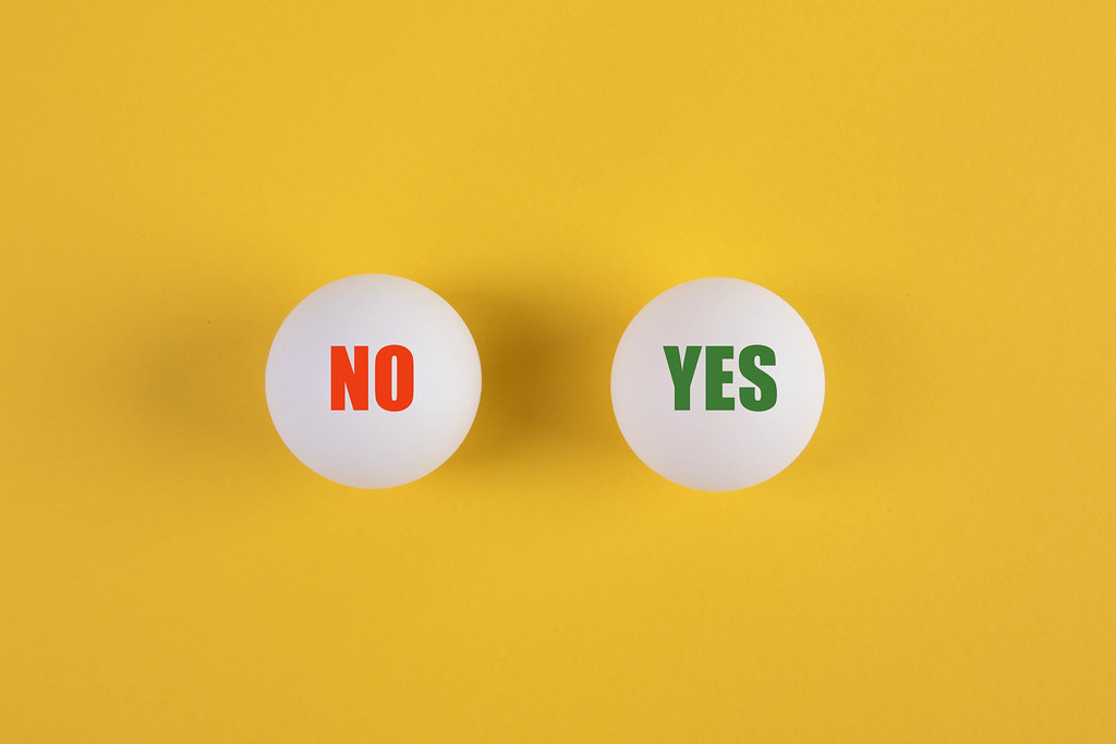 Table tennis balls with Yes and No text