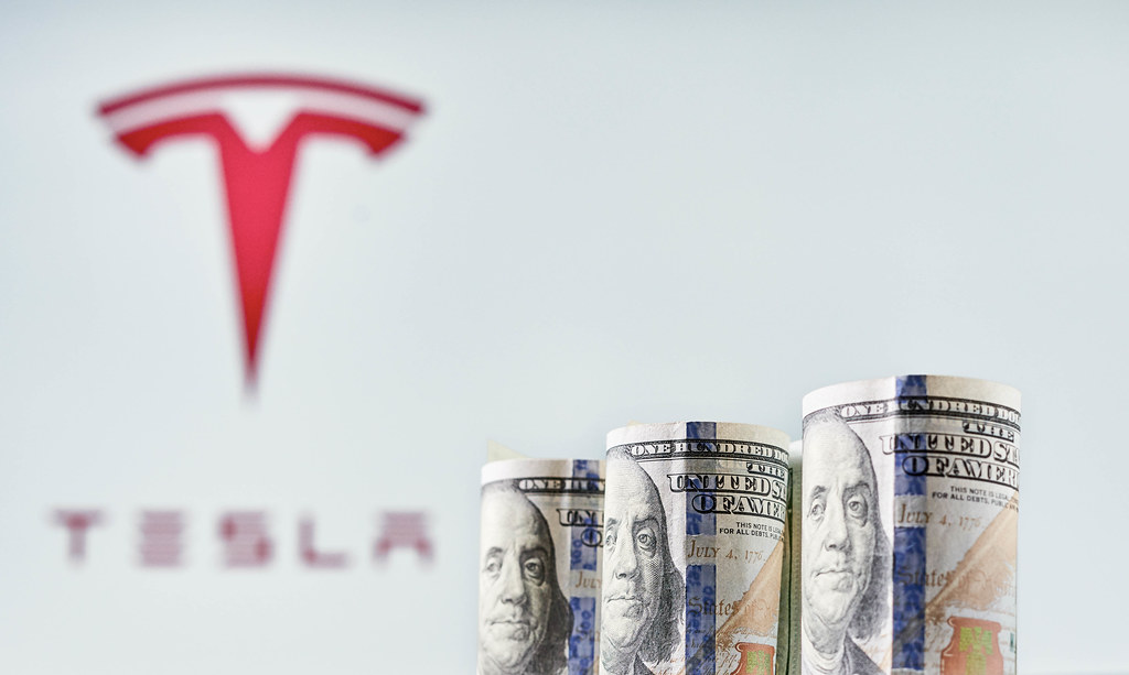 Tesla stock sinks as market gains