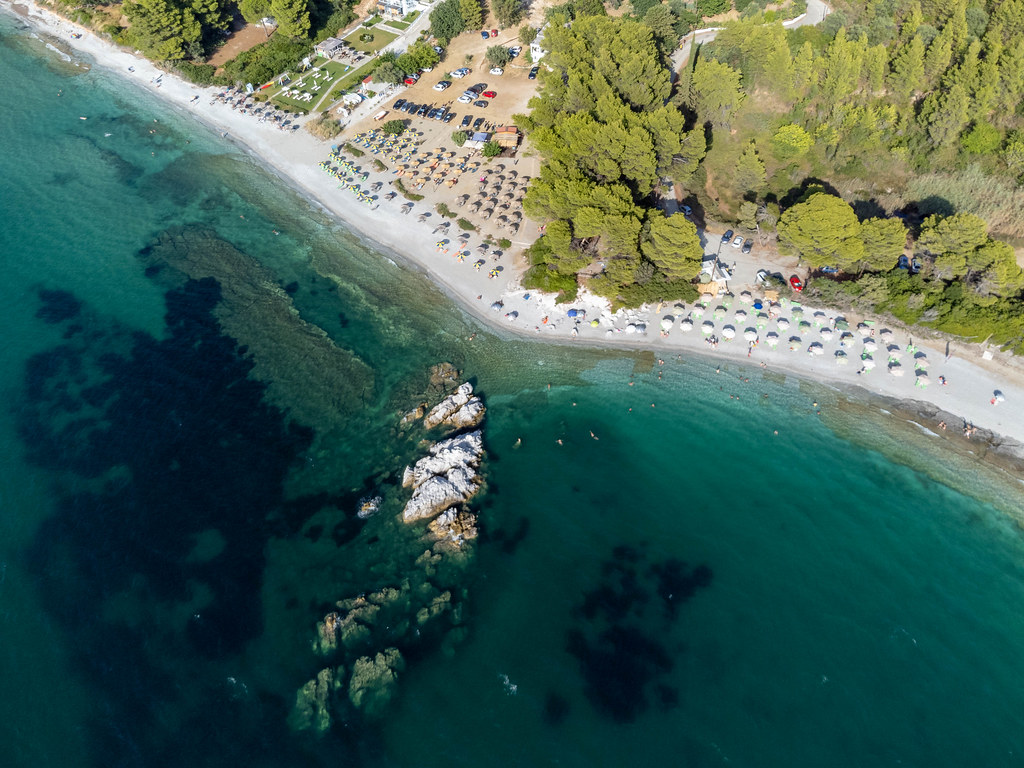The breathtaking Milia beach on Skopelos: aerial view of the turquoise waters and serviced beach