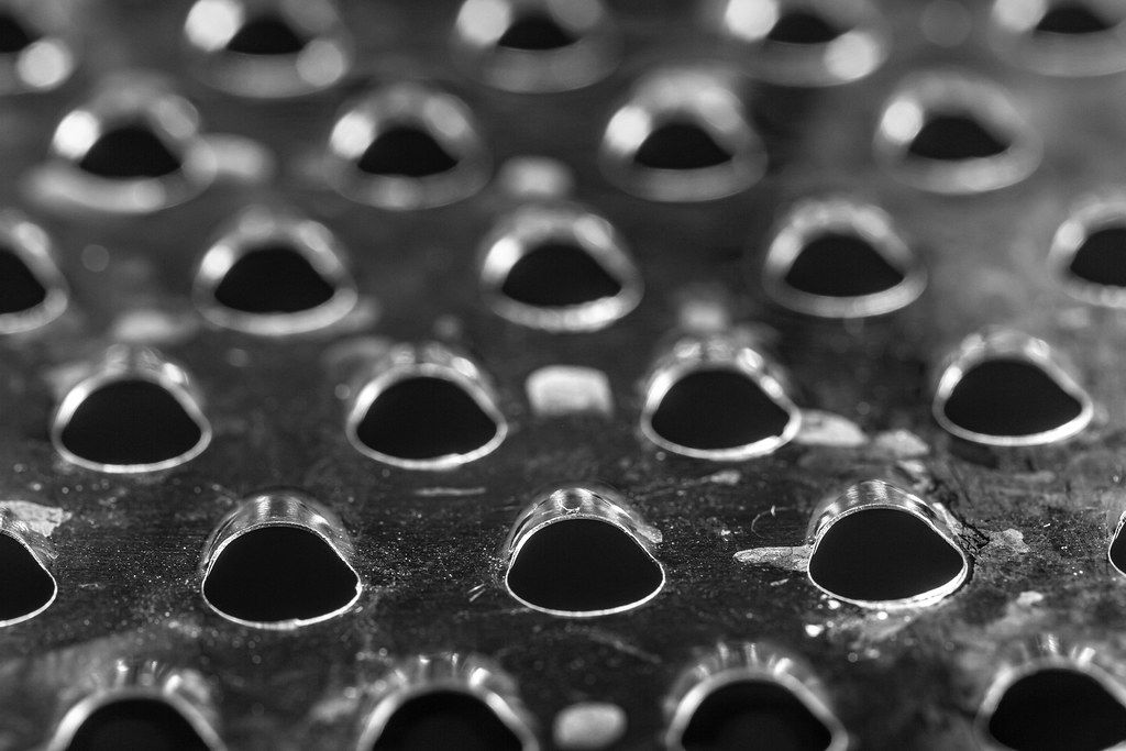 The texture of the surface of the kitchen grater, close up