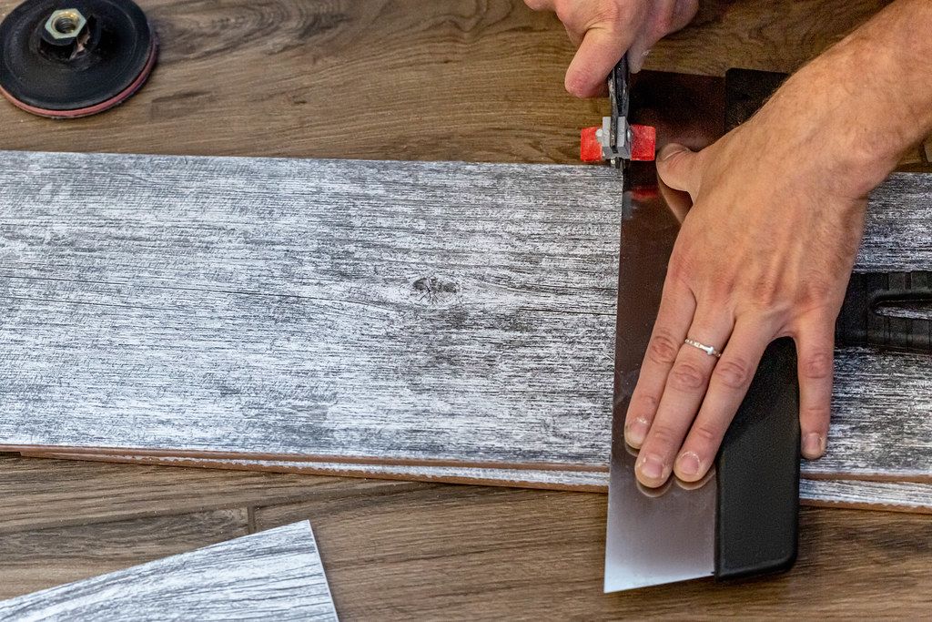 The wizard cuts the gray tile