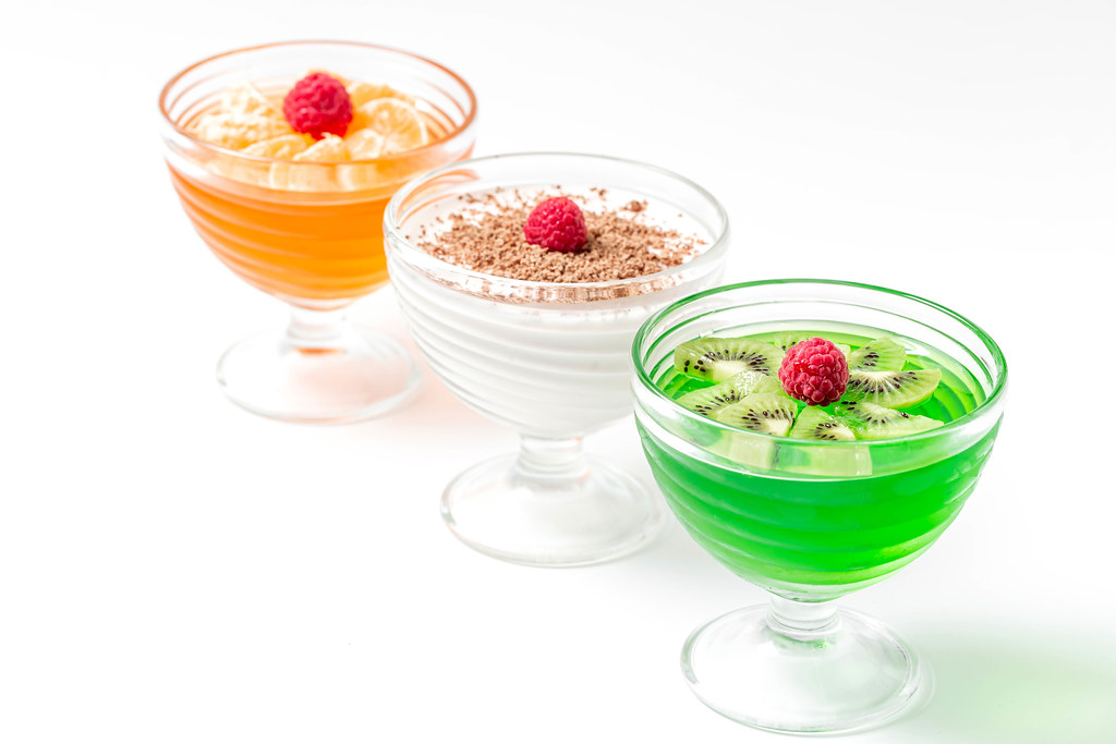 Three glass bowls of jelly desserts