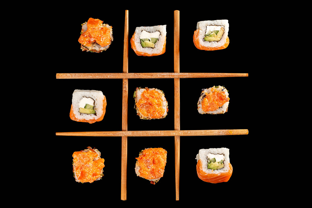 Tic-tac-toe game made from sushi, top view