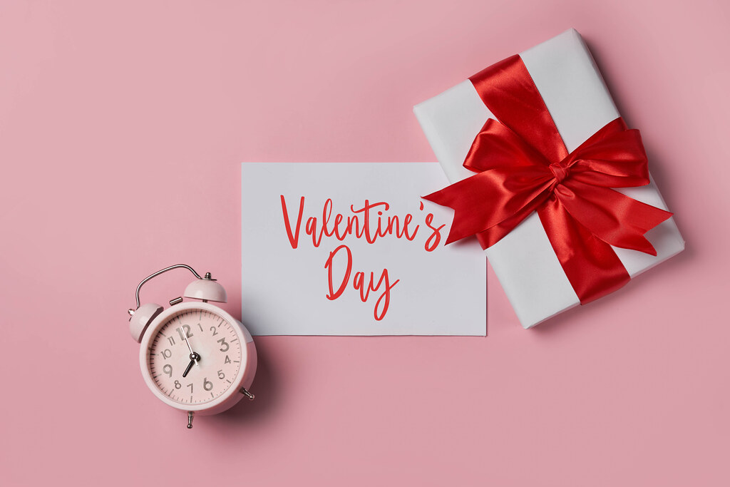 Time to celebrate Valentine's Day - Gift box and alarm clock.