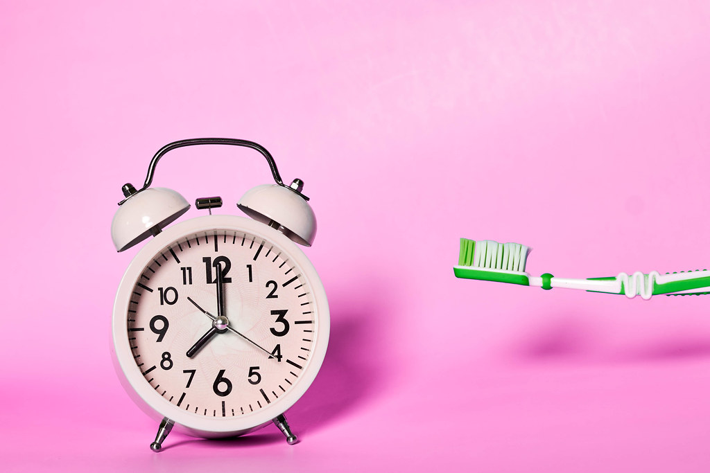Toothbrush and alarm clock - time to brush your teeth