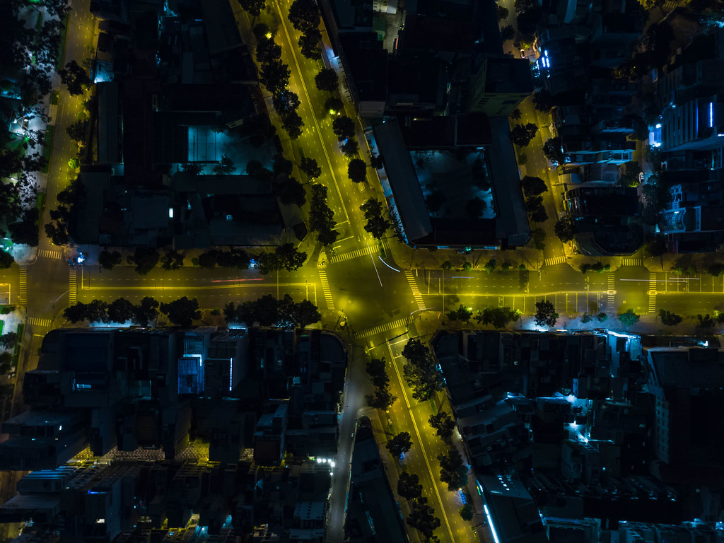 Top View Drone Photo of the Intersection of Tran Hung Dao and Nguyen Thai Hoc Street with Long Exposure Light Streaks in Ho Chi Minh City, Vietnam