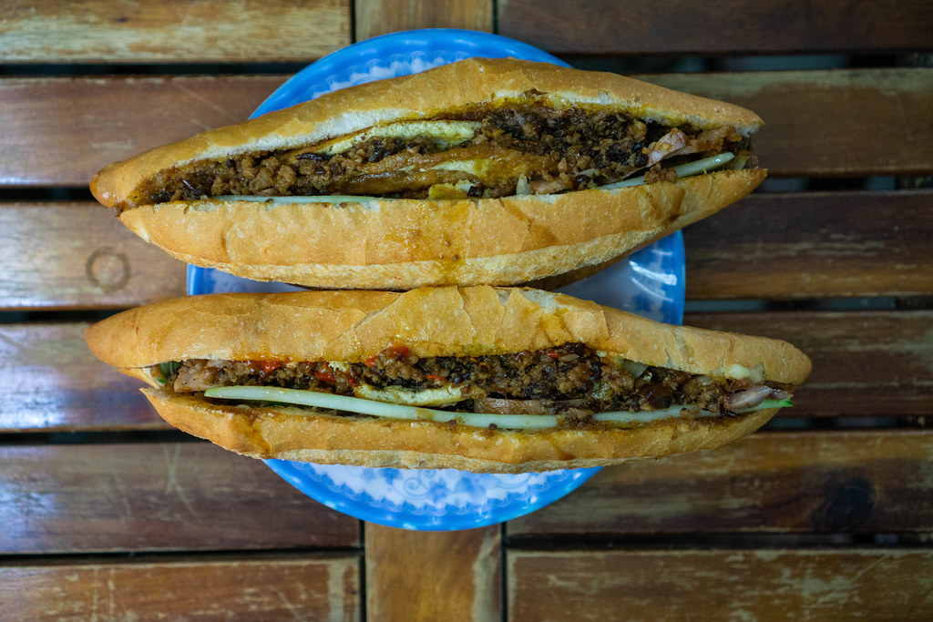 Top View Food Photo of the famous Banh Mi Sandwich of The Banh My Lady in Hoi An, Vietnam on a Wooden Table