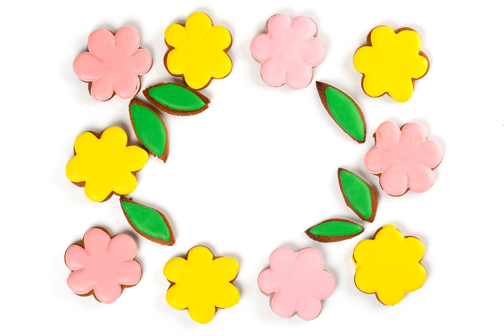 Top view, frame of yellow and pink gingerbread flowers
