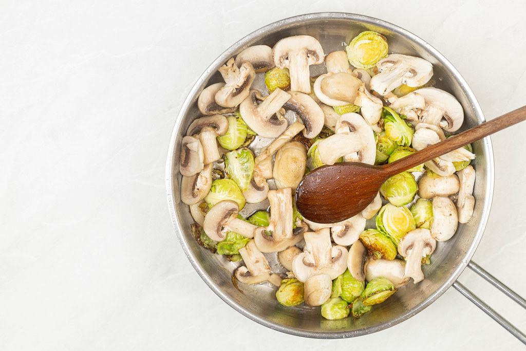 Top view of Brussel Sprouts with Mushrooms in the frying pan