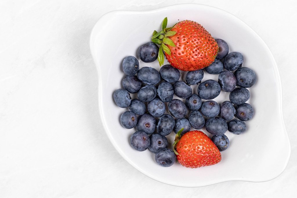 Top view of Fresh Blueberries and Strawberries with copy space