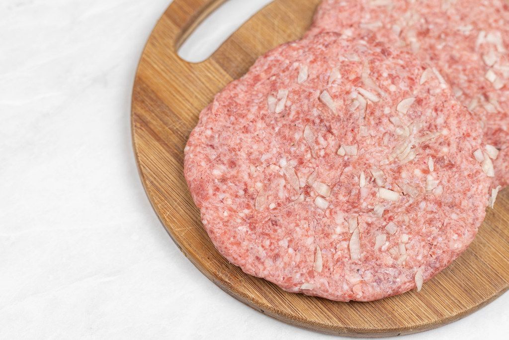 Top view of Serbian Pljeskavica with minced meat and onions