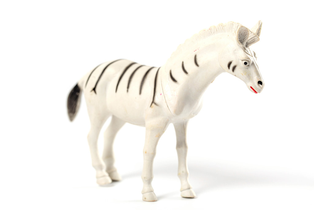 Toy animals zebra on white background