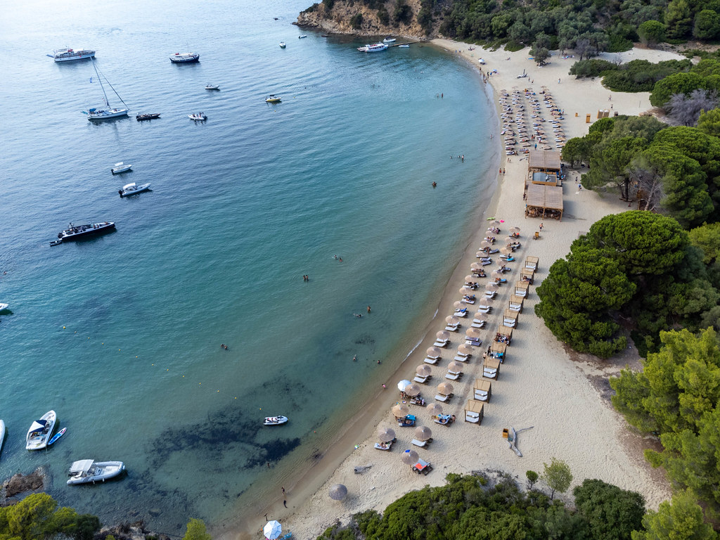 Tsougria beach on an islet across from the port of Skiathos town. Aerial view