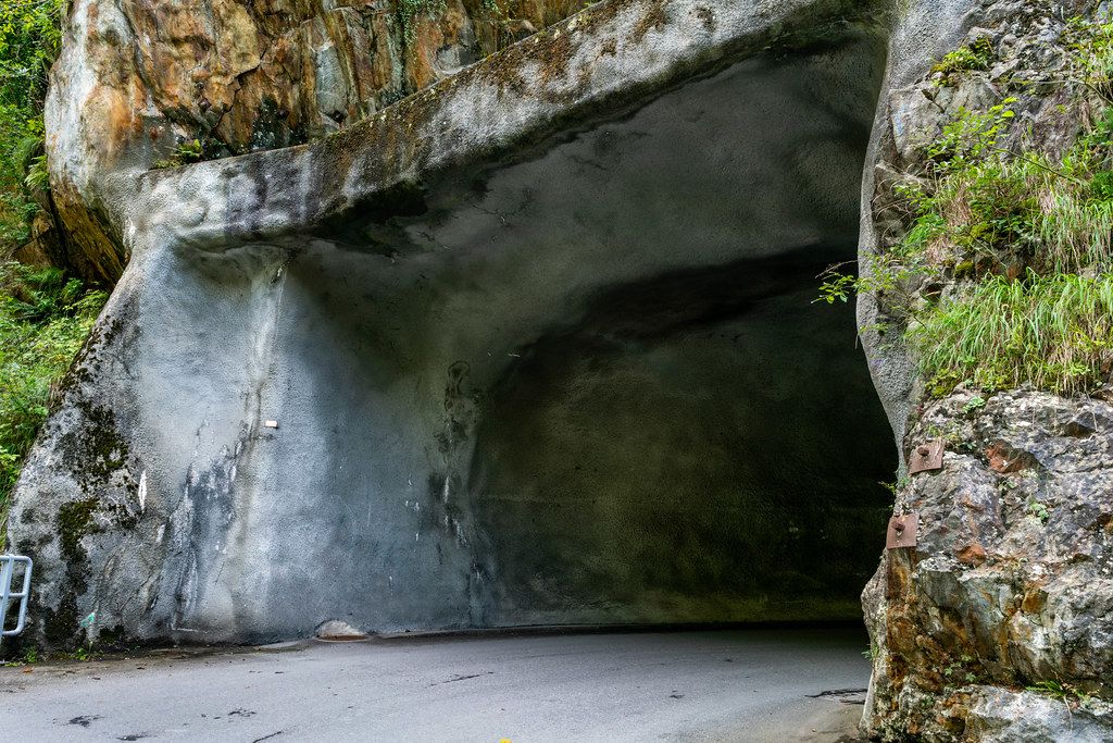 Tunnel in Swiss mountains carved out of a natural rock