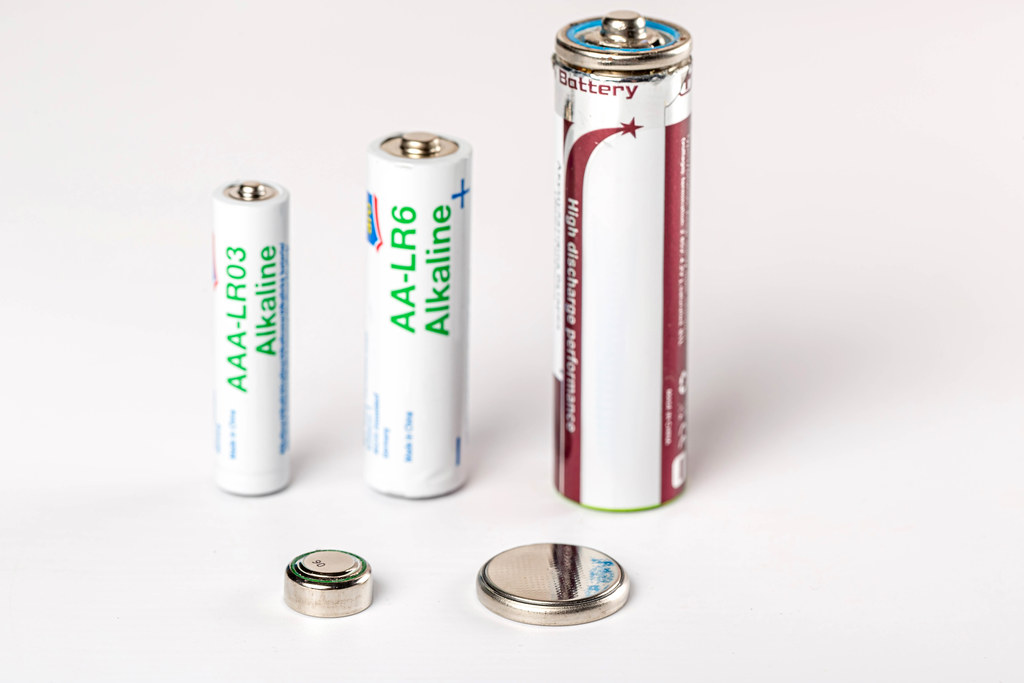 Variety of batteries on white background